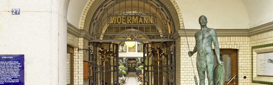 Entrance to Afrikahaus with the Wahehe warrior and wrought iron palms in the gate.